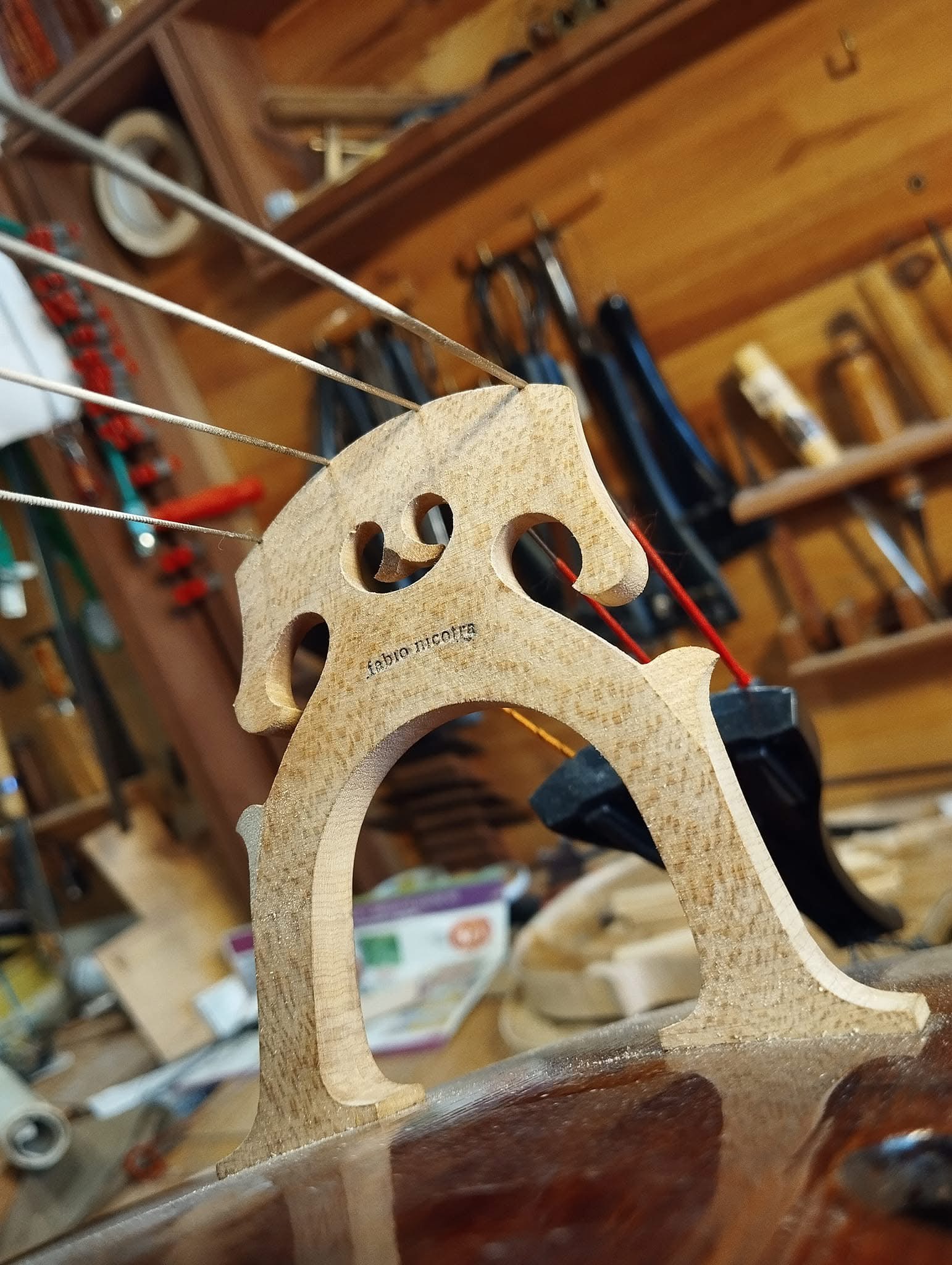 Handcrafted bridge for a string instrument in Fabio Nicotra atelier